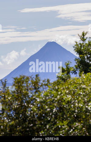 clear afternoon view of the Arenal volcano from across the lake Stock Photo
