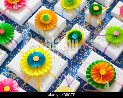 Blue background. Many gifts of different sizes. White gift boxes. Stock Photo