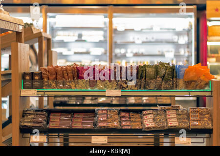 London, UK - September 30, 2017 - Nuts and energy bars displayed on shelves in Pret A Manger, an UK coffee and sandwich shop Stock Photo