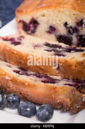 Freshly baked lemon blueberry bread sliced on a platter waiting to be served Stock Photo