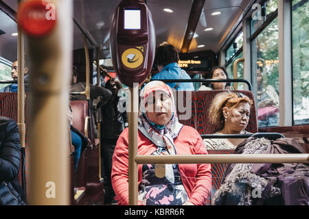 Passengers inside a New Routemaster, a hybrid diesel-electric double-decker bus operated in London, UK. Stock Photo
