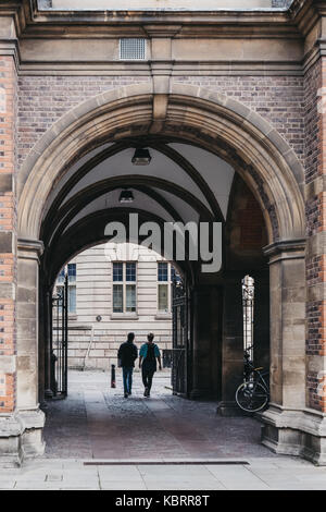 Students walking out of University of Cambridge. Cambridge is the second-oldest university in the English-speaking world. Stock Photo