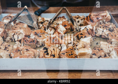 A tray of freshly baked Chelsea buns in cafe window Stock Photo
