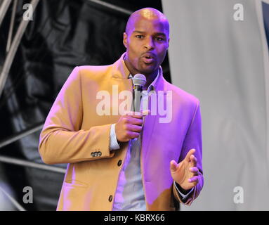London, UK. 30th September, 2017. Former New York Giants player and now BBC TV Analyst Osi Umenyiora at NFL on Regent Street - the length of London's major Shopping street is closed to traffic all day as fan event takes over. Celebrating the following day's NFL game between Miami Dolphins v New Orleans Saints at Wembley Stadium. Players from both teams appear on stage as well as 'NFL Legends' , Cheerleaders and personalities, London September 30th 2017  Photo by Keith Mayhew/Alamy Live News Stock Photo