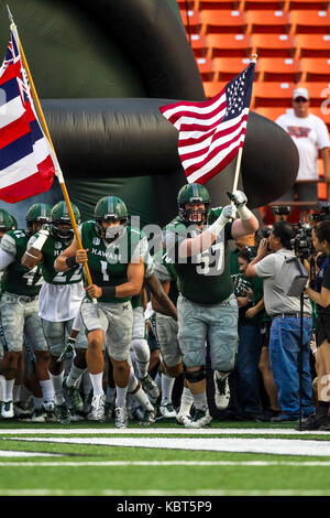 September 30, 2017 - Hawaii Rainbow Warriors linebacker Noah Borden (1) and Hawaii Rainbow Warriors defensive lineman Meffy Koloamatangi (97) run out of the tunnel before the NCAA football game between Colorado St. Rams and the University of Hawaii Warriors at Hawaiian Airlines Field at Aloha Stadium in Honolulu, Hawaii. Glenn Yoza/CSM Stock Photo