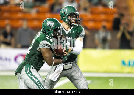 September 30, 2017 - Hawaii Rainbow Warriors quarterback Dru Brown (2) hands the ball off to Hawaii Rainbow Warriors running back Diocemy Saint Juste (22) during NCAA football game between Colorado St. Rams and the University of Hawaii Warriors at Hawaiian Airlines Field at Aloha Stadium in Honolulu, Hawaii. Glenn Yoza/CSM Stock Photo