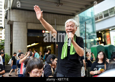 Hong Kong. 1st October, 2017. Inspired by the passing crowds pro democracy advocate Rev Chu Yiu-ming waves and greets the marchers. Hong Kong's 68th National Day is marked by a mass rally. Various political parties called for the rally in light of recent suppression of those speaking out against what they see as the disintegration of the Basic Law and the 'one country, two systems'' .Dubbed as the 'Anti-authoritarian rally-No more political Suppression. Credit: ZUMA Press, Inc. Credit: ZUMA Press, Inc./Alamy Live News Stock Photo