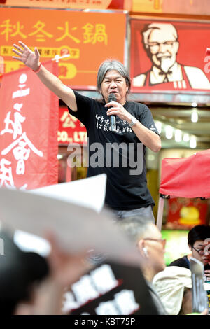 Hong Kong. 1st October, 2017. Pro-democracy activist, Leung Kwok-hung, known as ''Long-hair'' waves to the marchers and responses to their supportHong Kong's 68th National Day is marked by a mass rally. Various political parties called for the rally in light of recent suppression of those speaking out against what they see as the disintegration of the Basic Law and the 'one country, two systems'' .Dubbed as the 'Anti-authoritarian rally-No more political Suppression. Credit: ZUMA Press, Inc./Alamy Live News Stock Photo