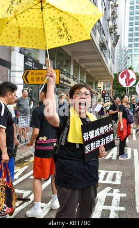 Hong Kong. 1st October, 2017. A protester screams in response to abuse from a pro-China spectator on the route.Hong Kong's 68th National Day is marked by a mass rally. Various political parties called for the rally in light of recent suppression of those speaking out against what they see as the disintegration of the Basic Law and the 'one country, two systems'' .Dubbed as the 'Anti-authoritarian rally-No more political Suppression. Credit: ZUMA Press, Inc./Alamy Live News Stock Photo