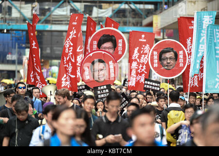 Hong Kong. 1st October, 2017. Protesters hold images of those they want removed form office.Various political parties called for the rally in light of recent suppression of those speaking out against what they see as the disintegration of the Basic Law and the 'one country, two systems'' .Dubbed as the 'Anti-authoritarian rally-No more political Suppression. Step Down Rimsky Yuen'', they are calling for and end to police action against those that speak out and the removal of Secretary of Justice, Rimsky Yuen Kwok-keung, from office. Credit: ZUMA Press, Inc./Alamy Live News Stock Photo