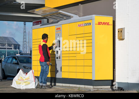 DHL Parcelstation. Parcelstations provide automated booths for self-service collection as well as self-service dispatch of parcels 24 hours a day. Stock Photo