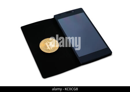 Gold coin of bitcoin lies on a smartphone on white isolated background. Electronic money mining concept. Bitcoin physical coin symbol. copy space Stock Photo