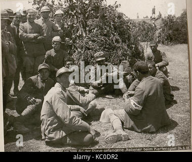 This historical photograph shows Italian prisoners of war digging a ...