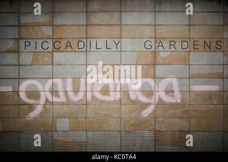 Manchester Piccadilly gardens wall with graffiti saying gauranga, term popularised by the Hare Krishna movement, Call out Gouranga and be happy Stock Photo