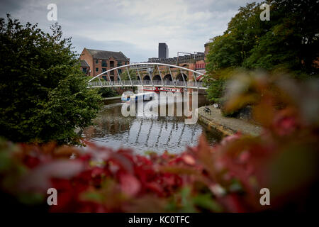 Narrowboat and canal waterways in Castlefiled basin in Manchester city centre Stock Photo