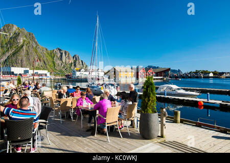 Guests having lunch on the terrace at Bacalao restaurant on the waterfront in Svolvær, Lofoten, Norway Stock Photo