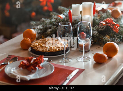 Holiday table with serving and Christmas decorations Stock Photo