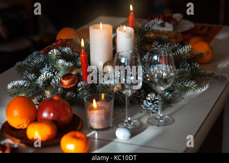 Beautifully decorated Christmas table. Candles and toys Stock Photo