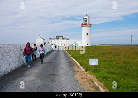 Visitors at Loop Head lighthouse, Kilbaha South, Loop Head peninsula, County Clare, Ireland Stock Photo
