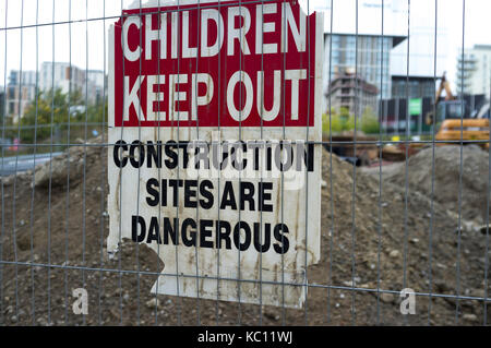 'Children Keep Out Construction Sites Are Dangerous' sign by building works in Stratford, London. Stock Photo