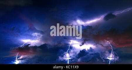 Thunderstorm clouds with lightning at night. Stock Photo