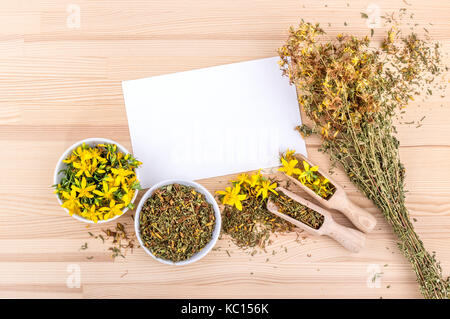 Top view of a cup of tea with dried and fresh St. John's wort and white card with copy space Stock Photo