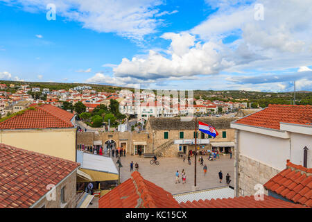 PRIMOSTEN, CROATIA - SEP 3, 2017: View of Primosten old town square from red tile roof top, Dalmatia, Croatia Stock Photo