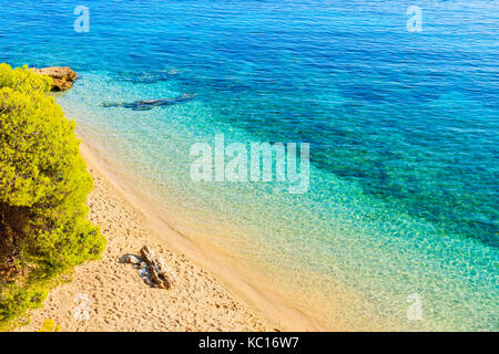 View of famous Zlatni Rat beach with beautiful sea water in Bol town, Brac island, Croatia Stock Photo