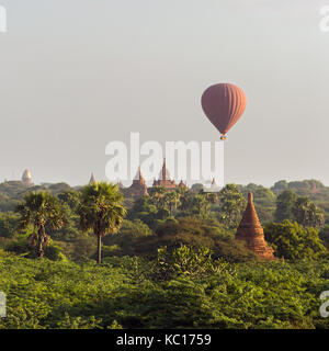 Air balloons over Buddhist temples at sunrise in Bagan, Myanmar. Stock Photo