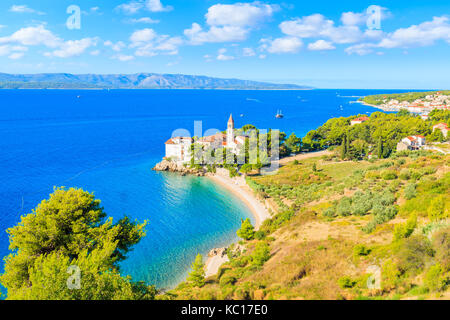 View of beautiful bay with beach and Dominican monastery in Bol town, Brac island, Croatia Stock Photo