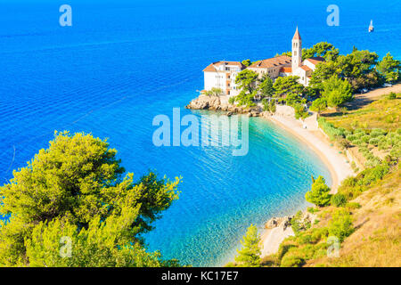 View of beautiful bay with beach and Dominican monastery in Bol town, Brac island, Croatia Stock Photo