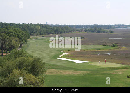 Aerial view of fairway of coastal golf course. Stock Photo