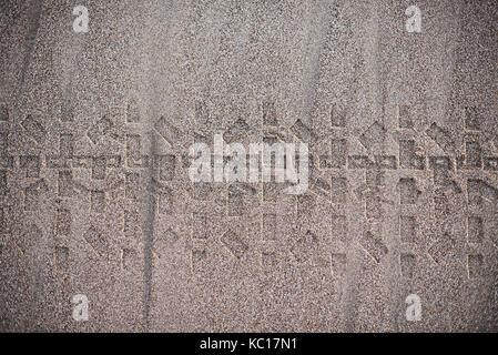 Wheel print mark on wet sand background. Car tyre trace on sand view from top Stock Photo