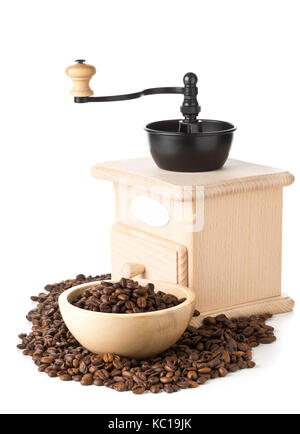 Coffee beans in wooden bowl with wooden coffee bean grinder over white background Stock Photo