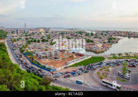 View over slums of Luanda with infamous traffic jams and Mausoleum of Agostinho Neto, Luanda, Angola, Africa Stock Photo