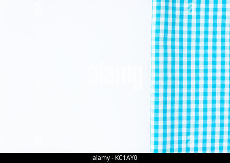 Turquoise, blue cloth, kitchen towel with checkered pattern, isolated on white background isolated. Stock Photo