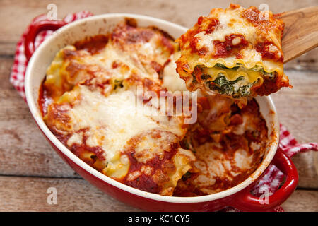 italian lasagna rolls with tomatoes spinach and ricotta cheese Stock Photo