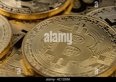 Gold Bitcoins as metaphor for concept of virtual currency, peer to peer digital payment, darkweb cybercrime, general cryptocurrencies, & exchange rate Stock Photo