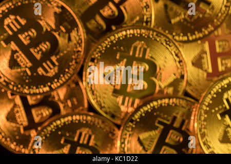 Gold Bitcoins as metaphor for concept of virtual currency, peer to peer digital payment, darkweb cybercrime, general cryptocurrencies, & exchange rate Stock Photo