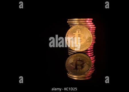 Gold Bitcoins as metaphor for concept of virtual currency, peer to peer digital payment, darkweb cybercrime, general cryptocurrencies, & exchange rate Stock Photo