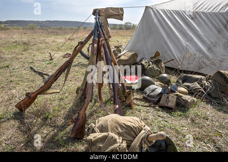 Weapons and equipment in a military camp during the Second World War. Historical Reconstruction Stock Photo