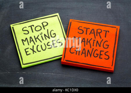 Stop making excuses, start making changes - handwriting on sticky notes against slate blackboard Stock Photo