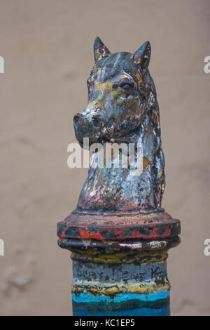 Closeup of old, rough horse head hitching post top. French Quarter, New Orleans, Louisiana. Stock Photo