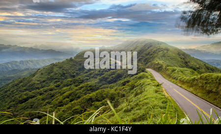 road under a sunrise time with nice sky with soft clouds Stock Photo