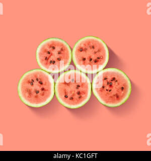 Watermelon slices isolated on pink background. Stock Photo