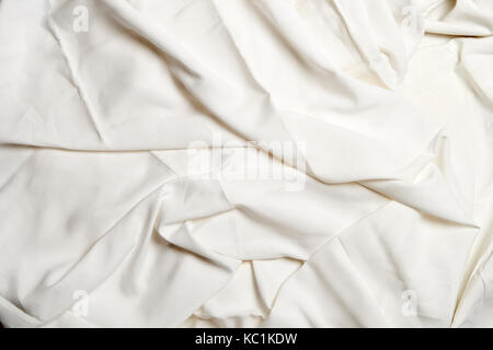 Horizontal version of textured white crumpled sheets Stock Photo