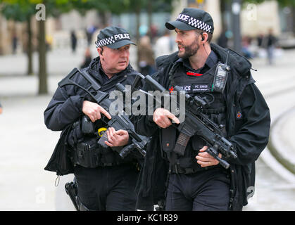 Manchester, UK.  Weapons, policing, police, uniform, british, force, officer, law, armed, security, control, england, patrol, gun, weapon, firearm, military, handgun, pistol, security, crime, protection, patrol, enforcement, cop, crime, shot, danger, black uniforms, firearms and equipment of British Armed Police on duty at the at the Conservative Annual Conference, 2018.