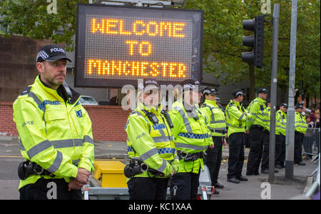 Manchester, UK. 1st October, 2017. Thousands of demonstrators bring the streets of Manchester to a standstill as protestors take part in 'a massive 'Tories Out' protest to end Austerity measures.  Anti-Brexit campaigners and activists protesting the government’s austerity policies are holding rallies to coincide with the start of the Conservative Party conference being held in the city centre. 100's of Police from outlying areas have been drafted in to the monitor the event with large areas of the city being subject to a cordon with many roads closed. Stock Photo