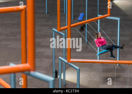 London, UK. 02nd Oct, 2017. Visitors enjoy the swings -0 The 2017 Hyundai Commission created by SUPERFLEX, a Danish collective, in the Turbine Hall at the Tate Modern. SUPERFLEX, known for their interests in unifying urban spaces and commenting on society with authenticity through art. London 02 Oct 2017. Credit: Guy Bell/Alamy Live News Stock Photo