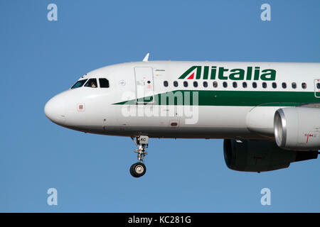 Close-up of an Alitalia Airbus A320 passenger jet plane on arrival, showing the airline's logo Stock Photo